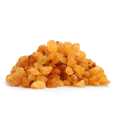 a pile of raisins on a white background
