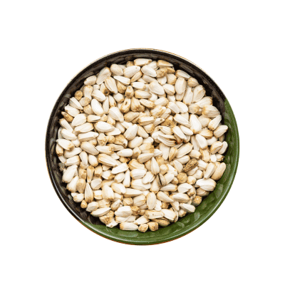 a bowl of white and brown seeds